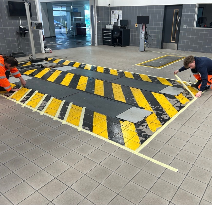 Porsche Norwich City — workshop hazard marking install